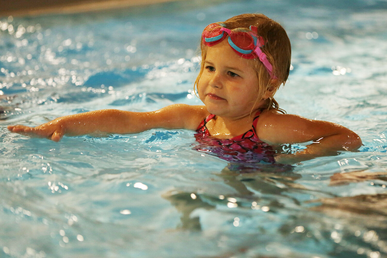 Marin Pierson, 3, practices her monster arms at the very beginning of her swim lesson